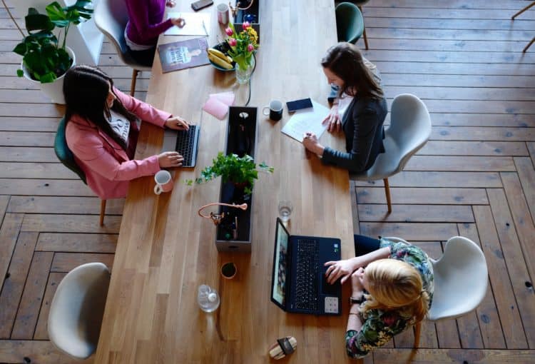 three people sitting at a table