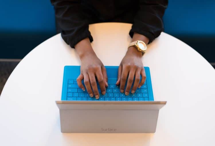 A person typing on their computer