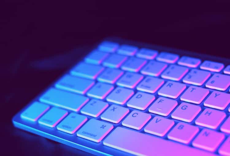 A keyboard in purple light