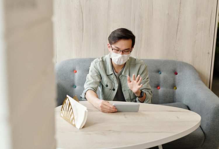 A person on a virtual meeting on their phone