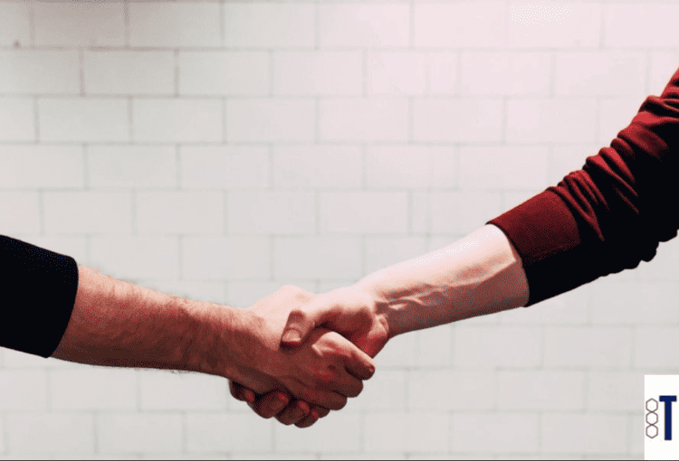 Two people shaking hands