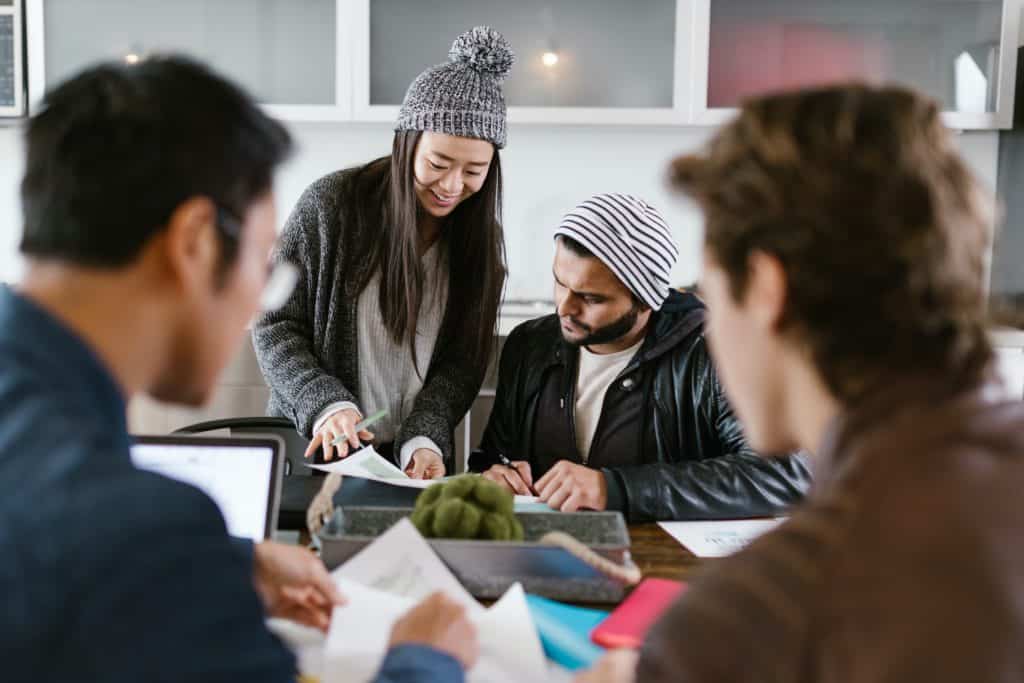 a group of people having a conversation - like how people in Microsoft teams can communicate and collaborate easily