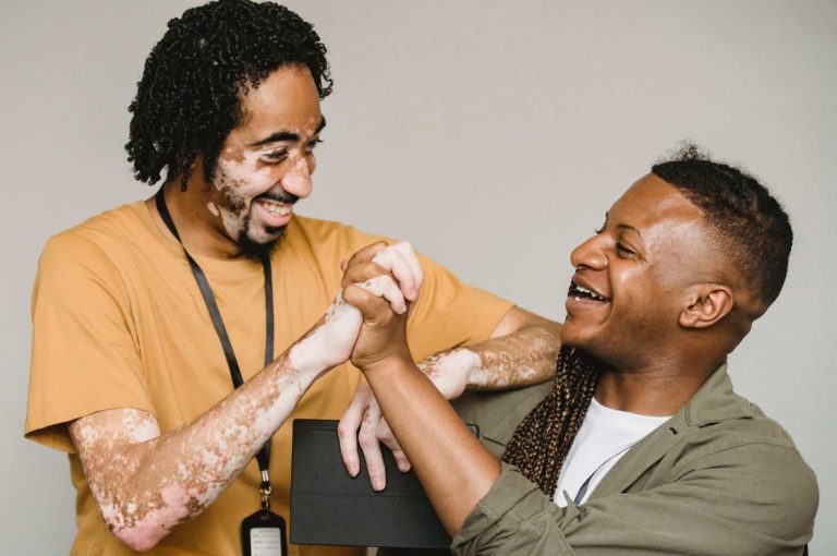 two people holding hands and smiling