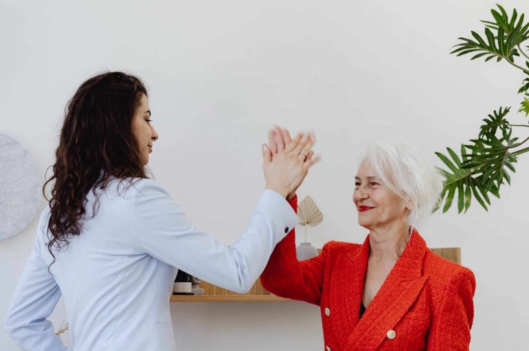 two people high fiving