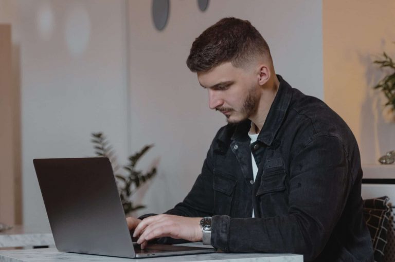 A person typing on their computer